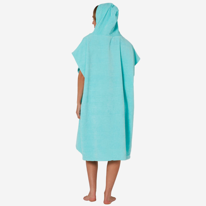 Person wearing a turquoise hooded towel against a white background