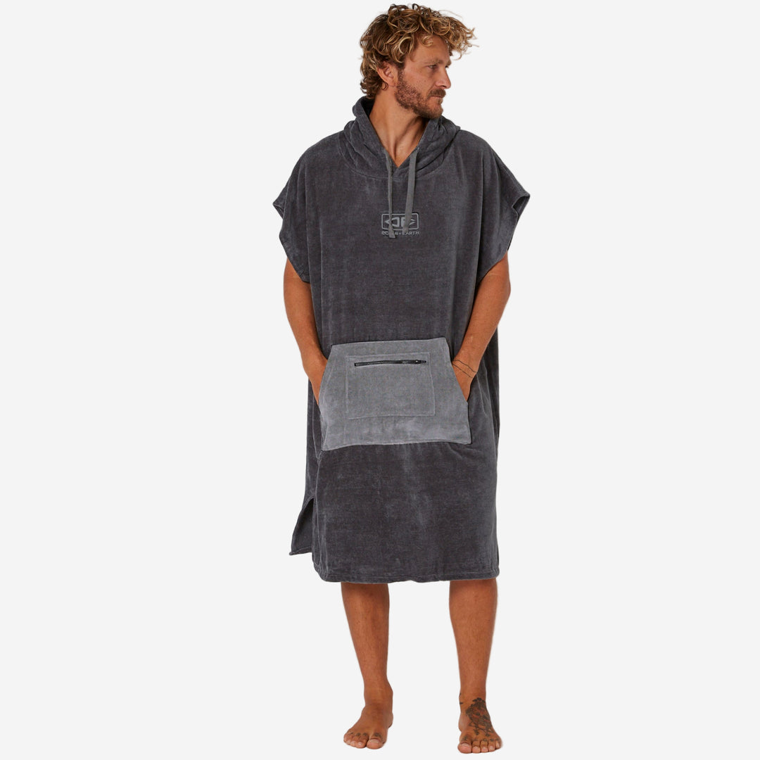 Man wearing a gray hooded towel on a white background