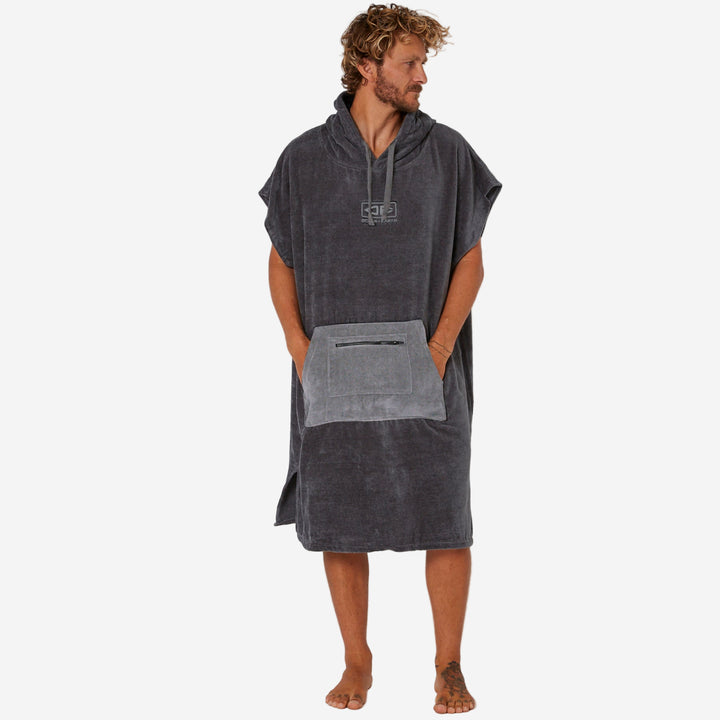 Man wearing a gray hooded towel on a white background